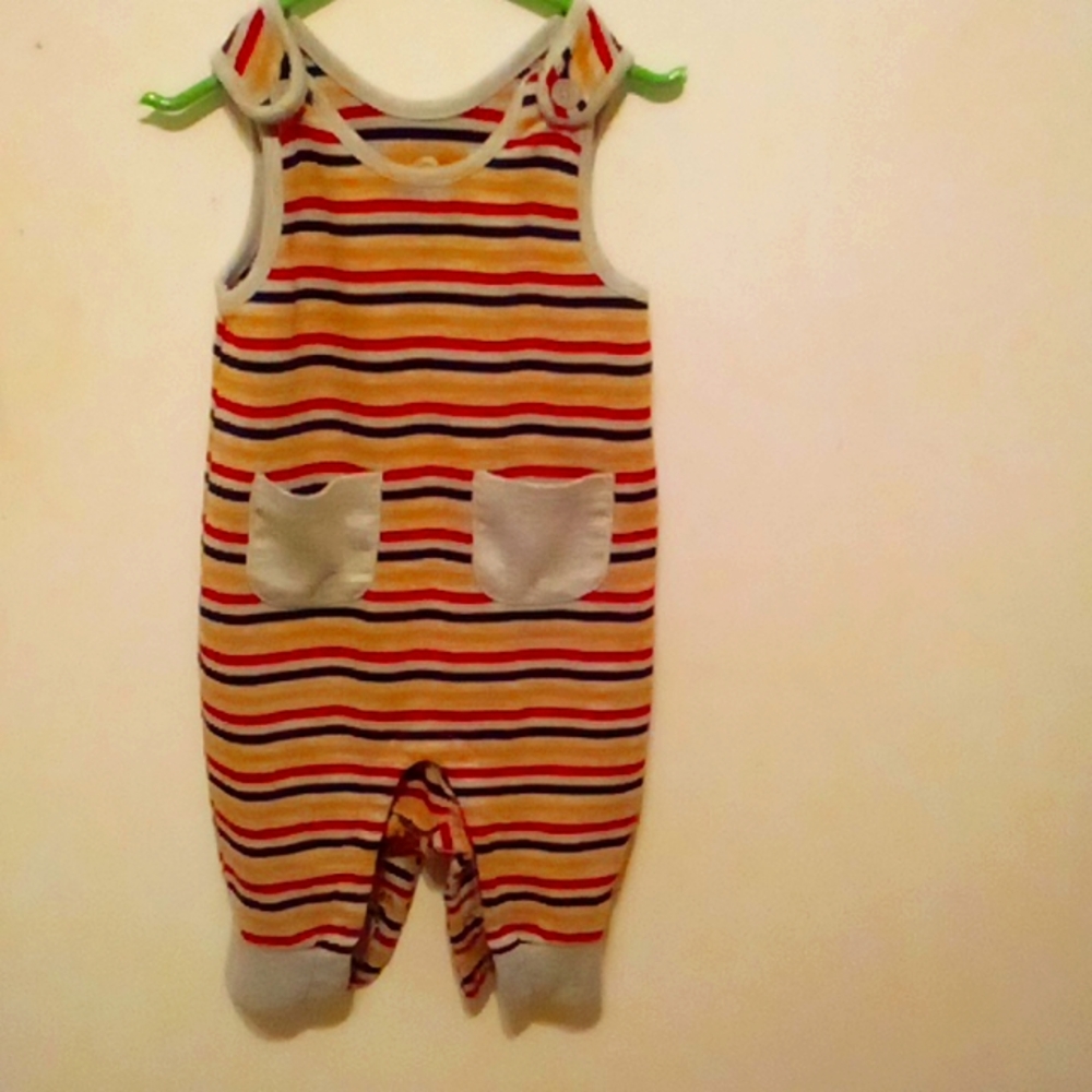 A jumper never worn. Buttons in between legs.